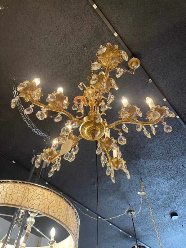 bottom view of large vintage chandelier with floral arms