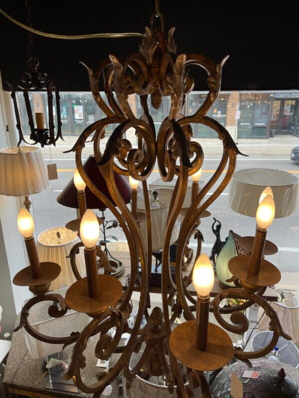 “Overhead chandelier shot showing ornate top crown”