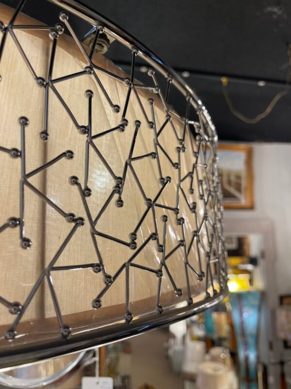Close-up of chrome and embroidery drum chandelier
