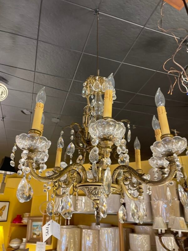 Underside view of vintage crystal-arm chandelier