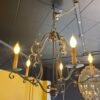 "Scrolled arm chandelier in aged bronze finish"