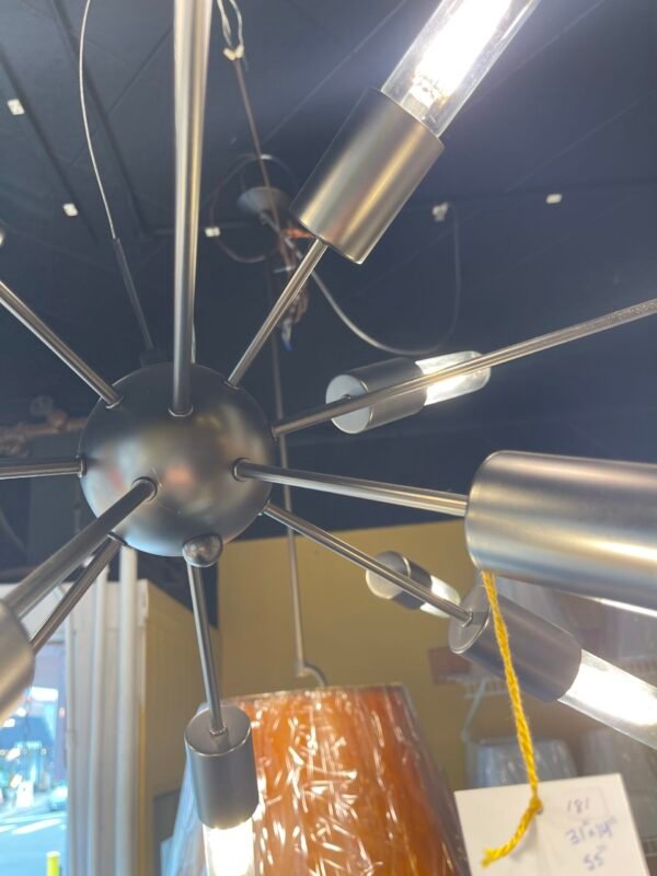 Modern brushed steel Sputnik chandelier with 12 tubular bulbs suspended from a central sphere