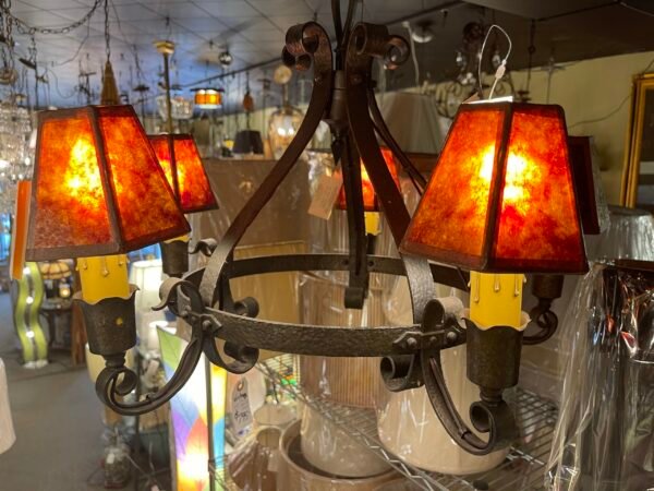 Vintage wrought iron chandelier with red shades