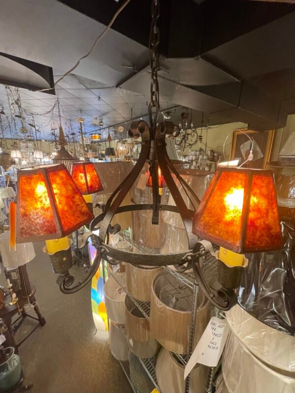 Scroll arm detail on iron chandelier