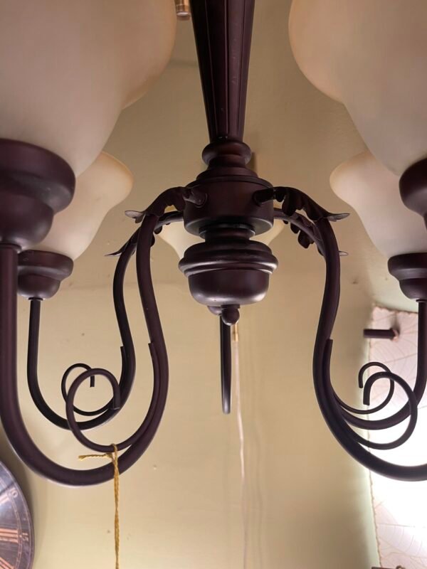 Close-up of bronze finish and scroll detail
