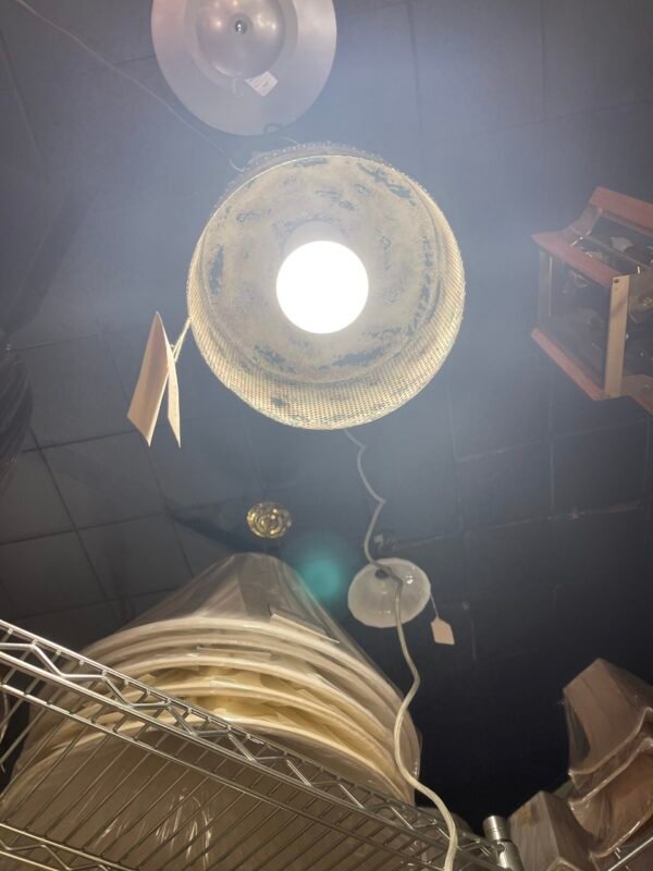 Bottom view of lit industrial pendant fixture
