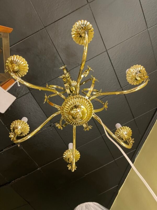 Bottom view of symmetrical six-arm chandelier