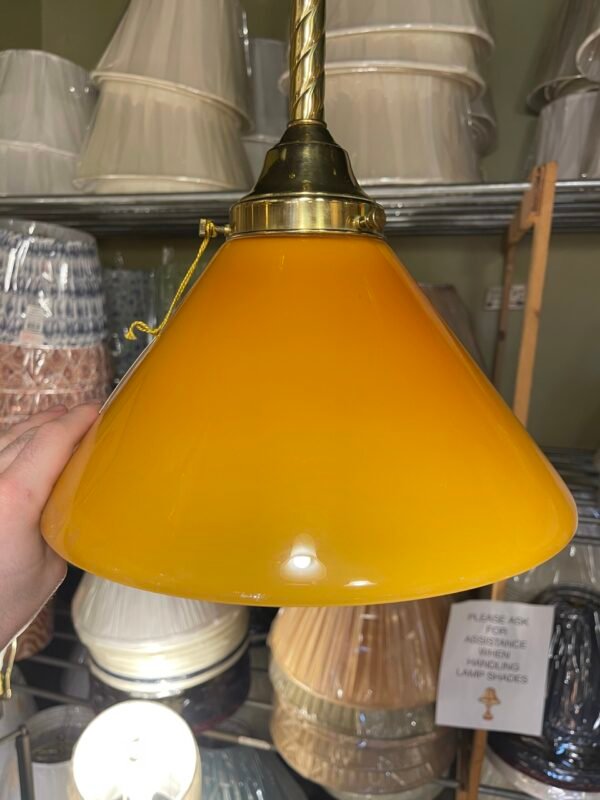 Amber glass pendant light with brass hardware