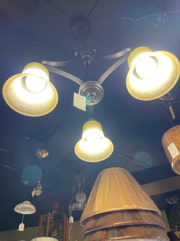 Bronze ceiling light with three frosted amber lights