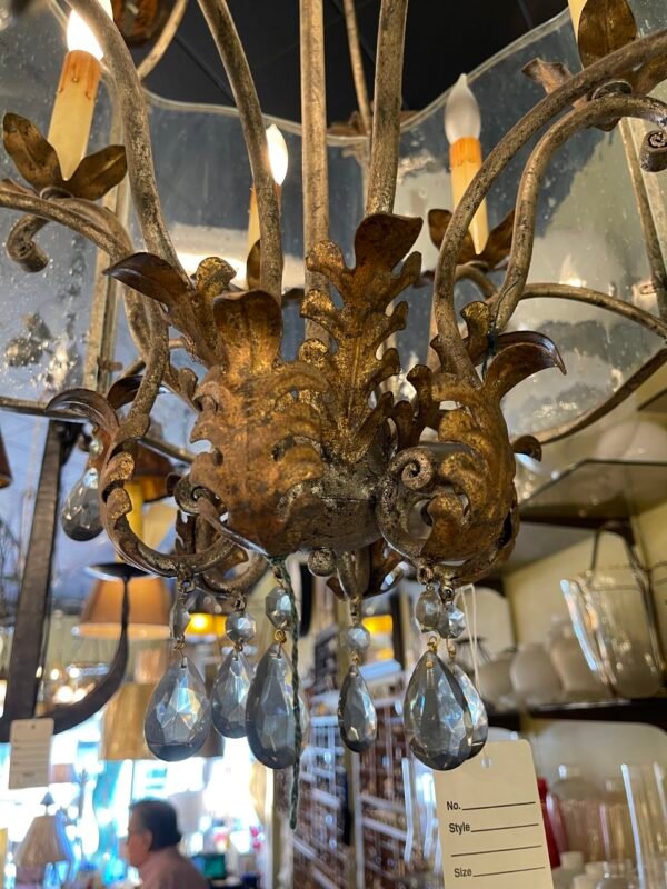 Aged metal chandelier with botanical accents