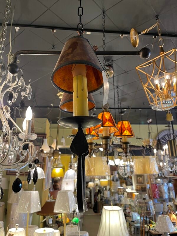 Close-up of amber mini shades and ironwork