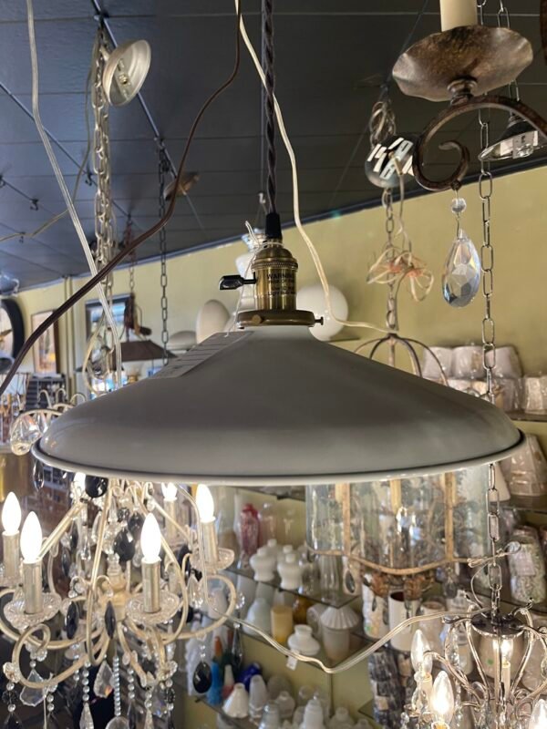 Underside of white factory shade light