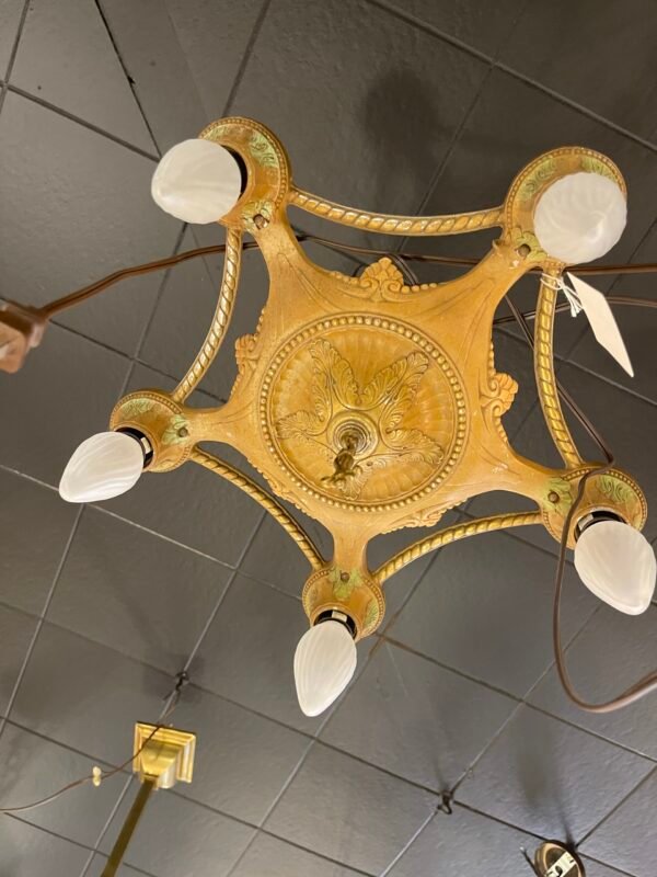 Ornate cast iron ceiling light with gold finish