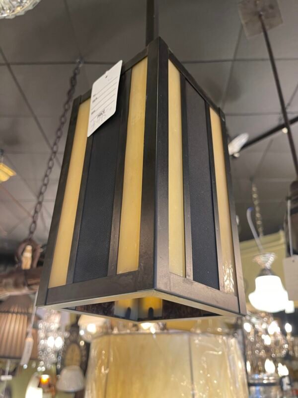 Hanging geometric pendant in dark metal
