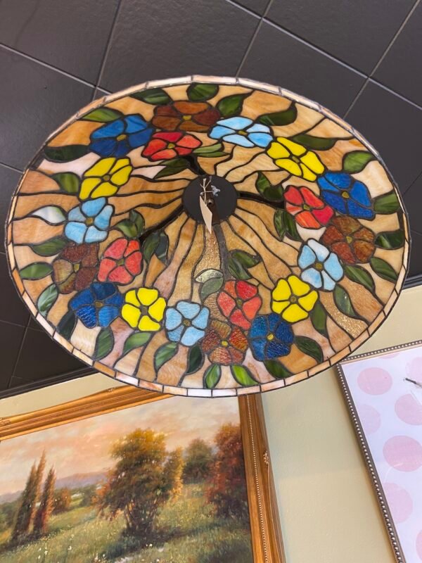 Colorful antique stained glass pendant light with floral pattern in blue, yellow, red, and green