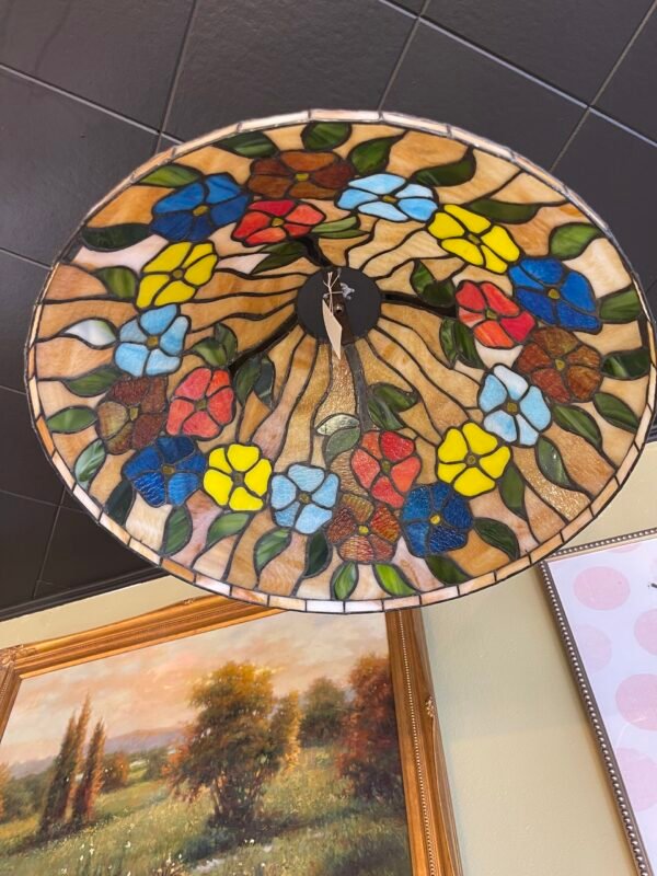 Colorful antique stained glass pendant light with floral pattern in blue, yellow, red, and green