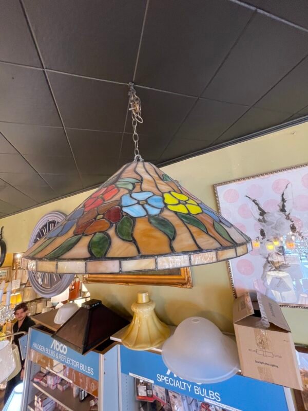 Colorful antique stained glass pendant light with floral pattern in blue, yellow, red, and green