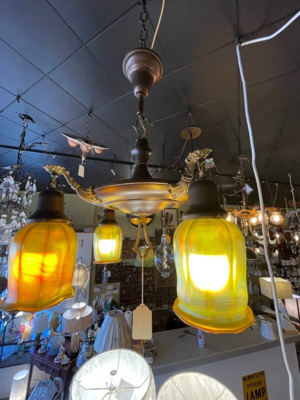 Antique brass chandelier with yellow glass shades